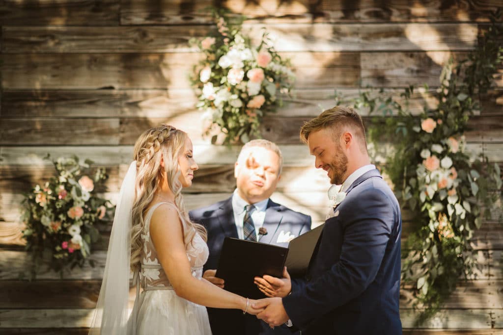 Garden wedding ceremony at the Venue at Lilly Lou's. Photo by OkCrowe Photography.