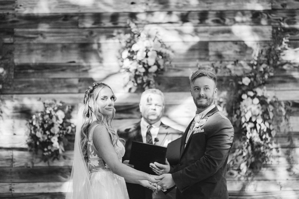 Garden wedding ceremony at the Venue at Lilly Lou's. Photo by OkCrowe Photography.