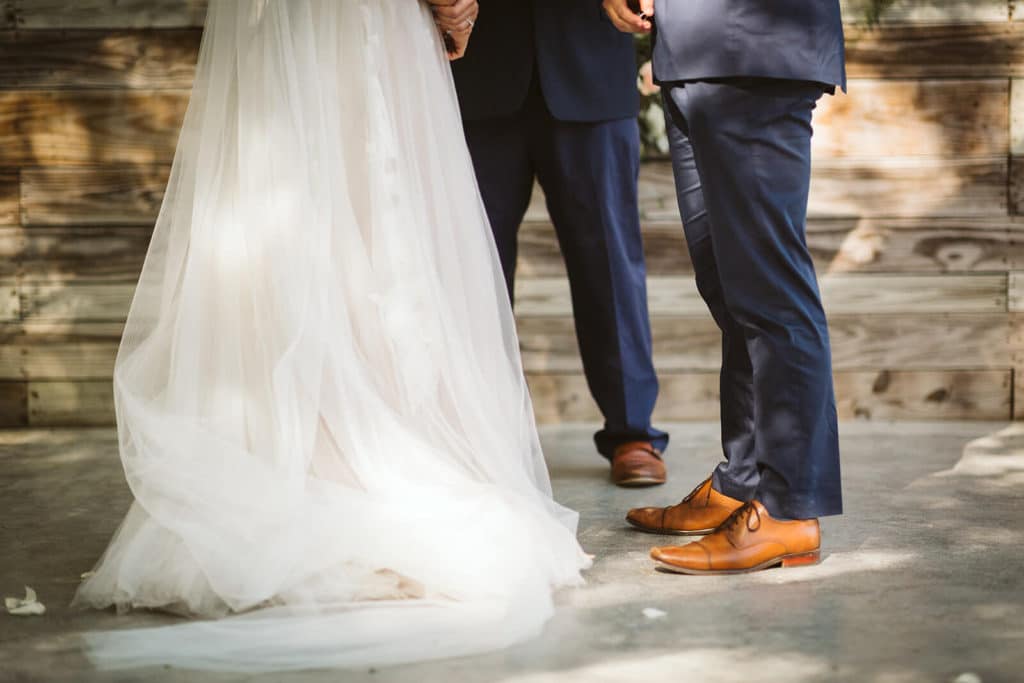 Garden wedding ceremony at the Venue at Lilly Lou's. Photo by OkCrowe Photography.