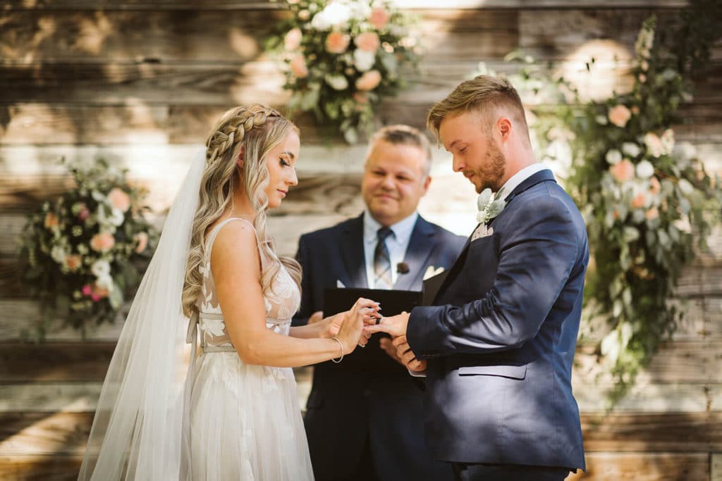 Garden wedding ceremony at the Venue at Lilly Lou's. Photo by OkCrowe Photography.