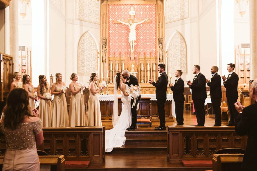Wedding ceremony at Basilica of Saints Peter and Paul. Photo by OkCrowe Photography.