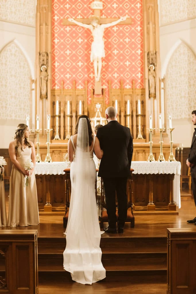 Wedding ceremony at Basilica of Saints Peter and Paul. Photo by OkCrowe Photography.