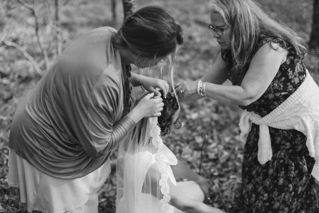 Getting ready for a secret North Carolina mountain elopement. Photo by OkCrowe Photography.