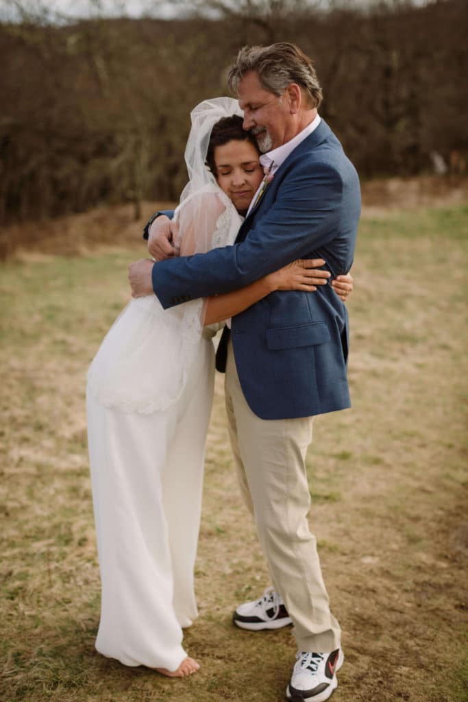 Father and daughter first look at a secret North Carolina mountain elopement. Photo by OkCrowe Photography.