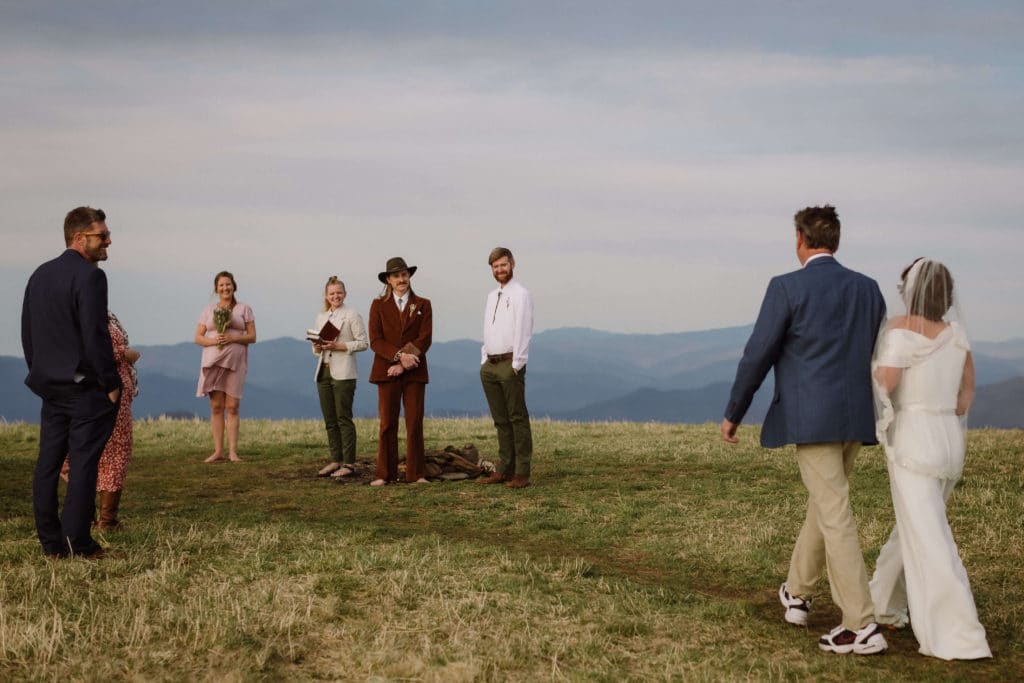 Ceremony at a secret North Carolina mountain elopement. Photo by OkCrowe Photography.