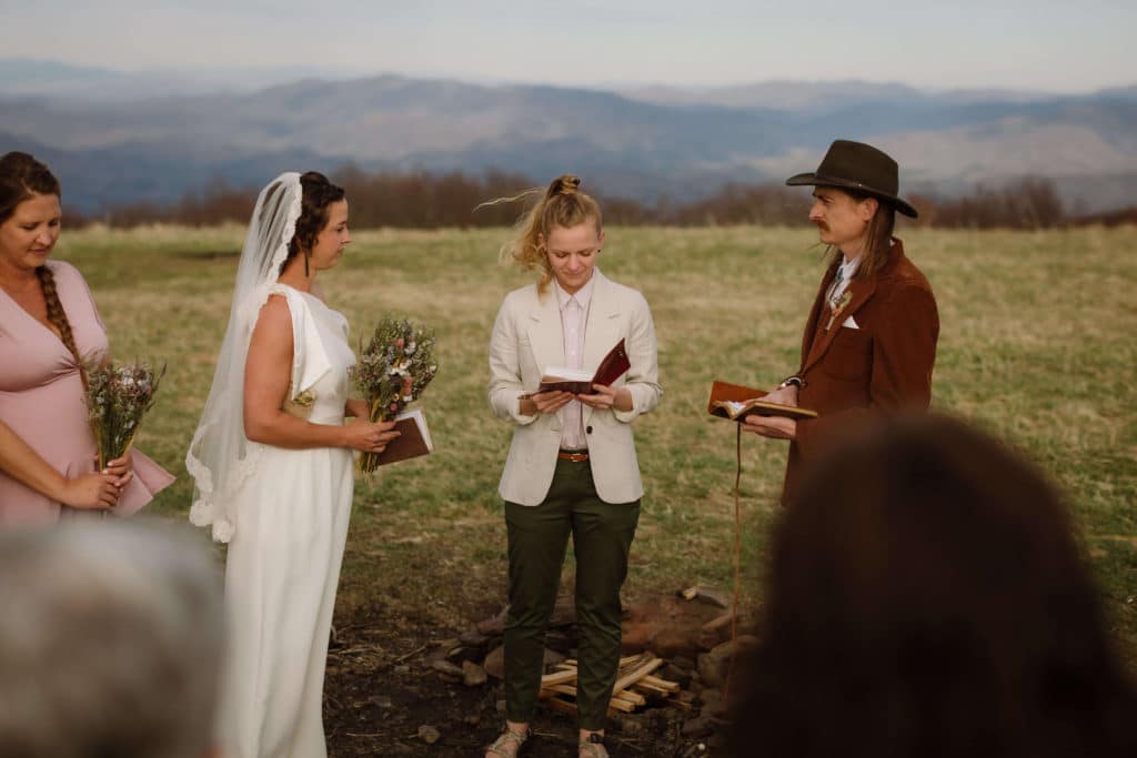 Ceremony at a secret North Carolina mountain elopement. Photo by OkCrowe Photography.