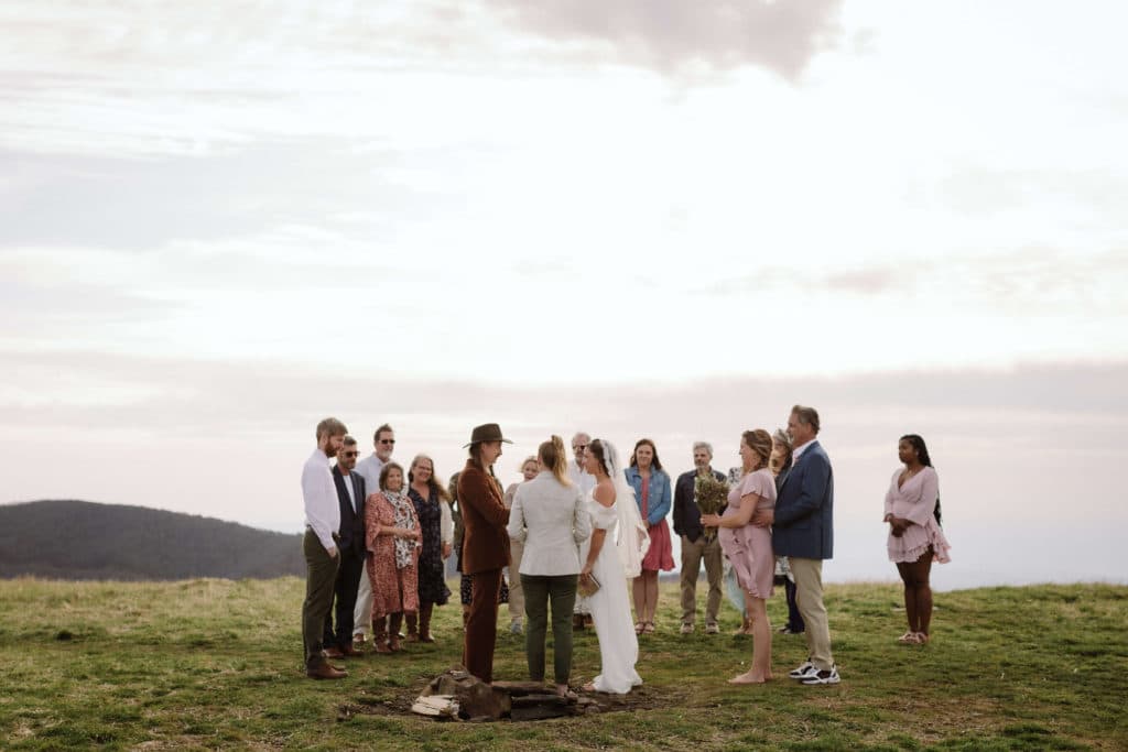 Ceremony at a secret North Carolina mountain elopement. Photo by OkCrowe Photography.