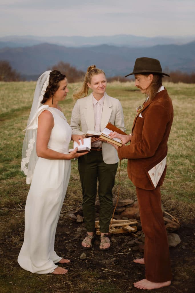 Ceremony at a secret North Carolina mountain elopement. Photo by OkCrowe Photography.