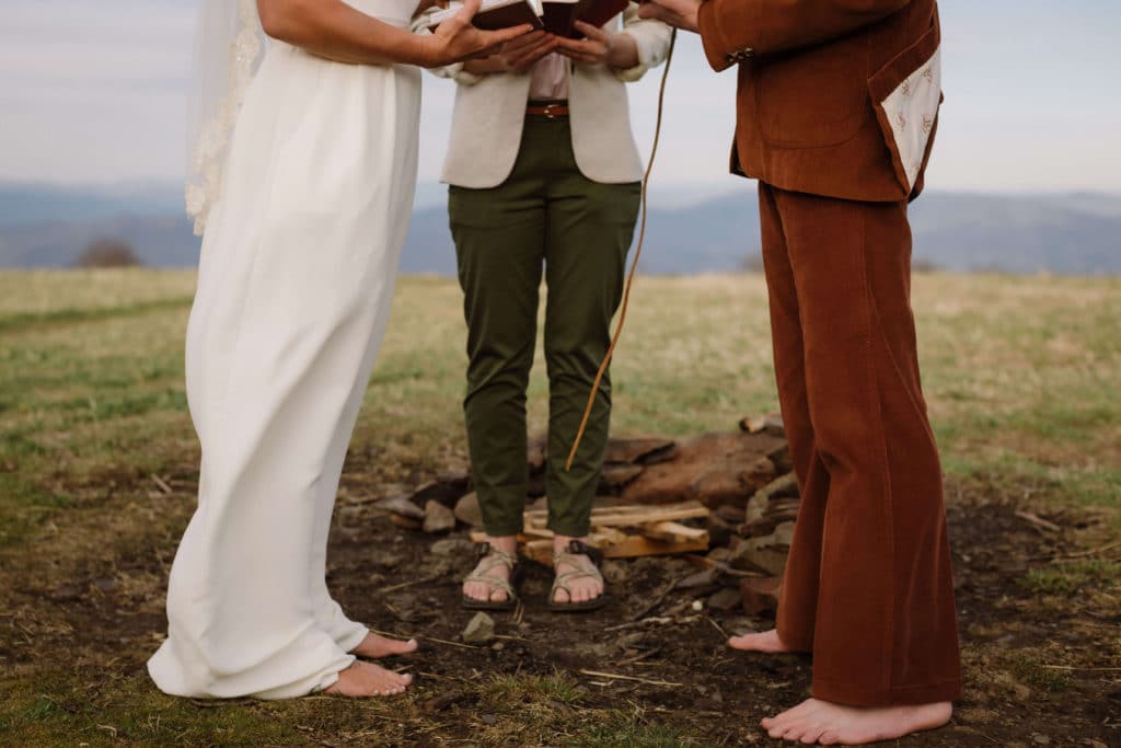 Ceremony at a secret North Carolina mountain elopement. Photo by OkCrowe Photography.