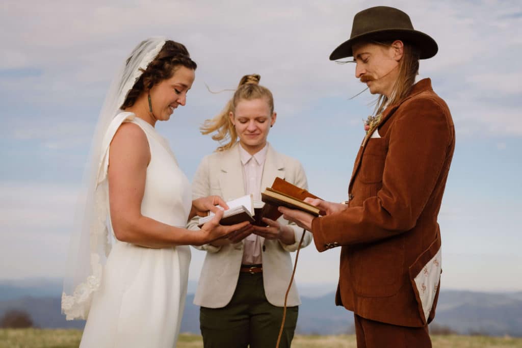 Ceremony at a secret North Carolina mountain elopement. Photo by OkCrowe Photography.