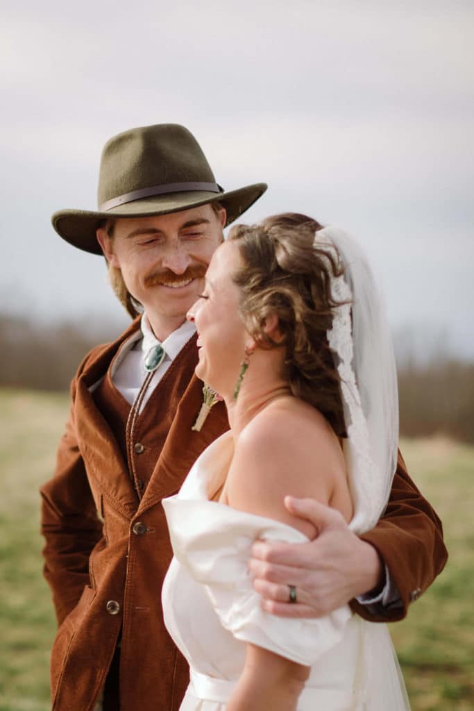 Ceremony at a secret North Carolina mountain elopement. Photo by OkCrowe Photography.