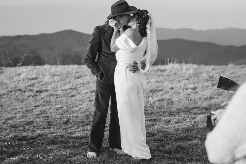 Ceremony at a secret North Carolina mountain elopement. Photo by OkCrowe Photography.