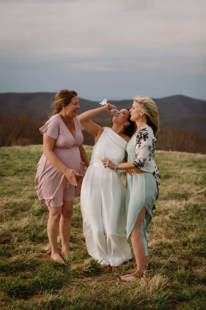 Friends and family at a secret North Carolina mountain elopement. Photo by OkCrowe Photography.