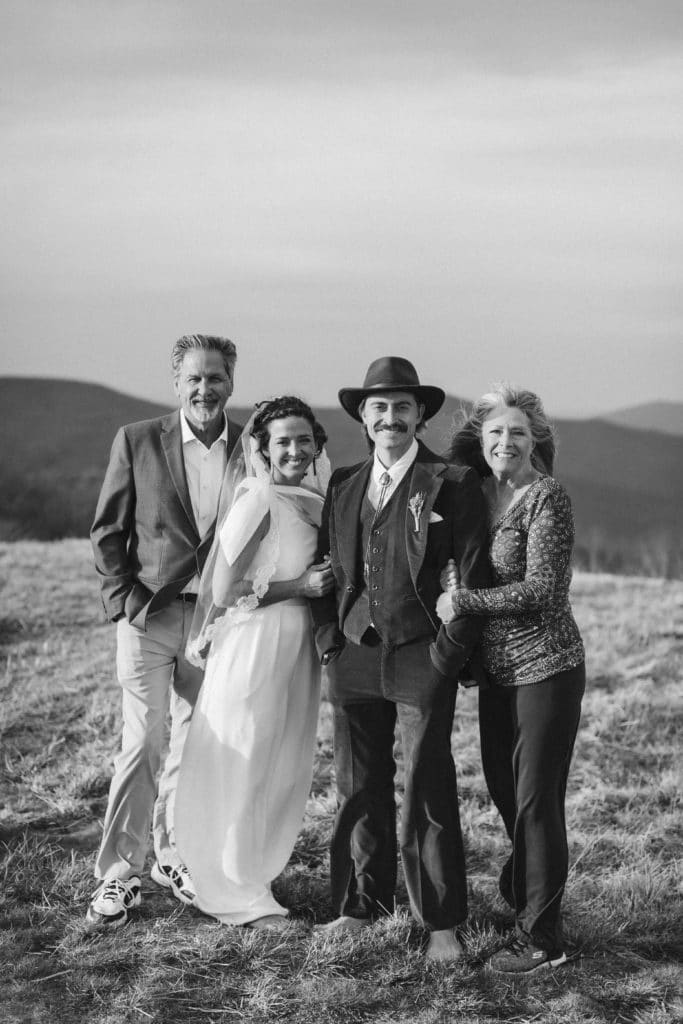 Friends and family at a secret North Carolina mountain elopement. Photo by OkCrowe Photography.