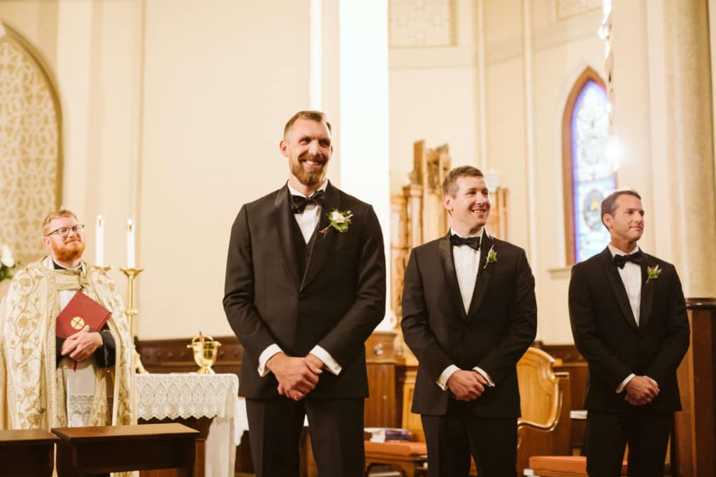 Ceremony at the Basilica of Saints Peter and Paul. Photo by OkCrowe Photography.