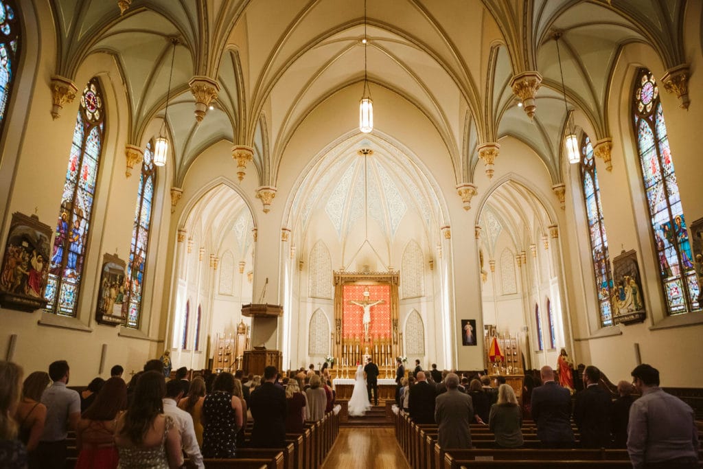 Ceremony at the Basilica of Saints Peter and Paul. Photo by OkCrowe Photography.