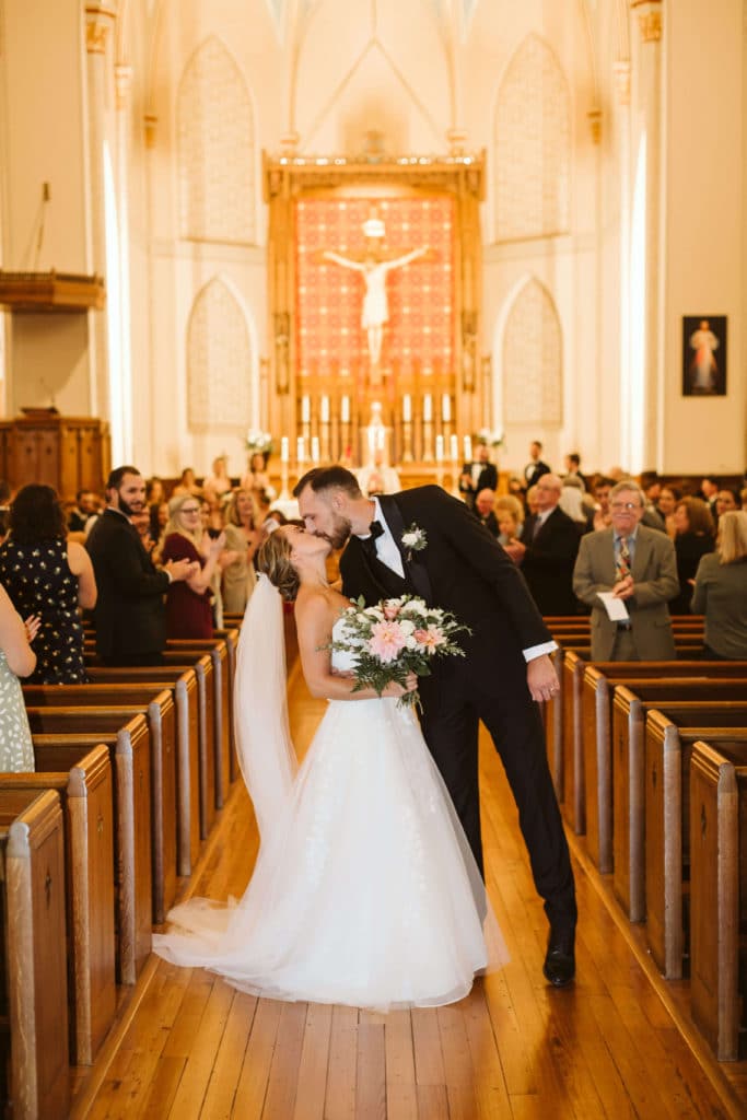 Ceremony at the Basilica of Saints Peter and Paul. Photo by OkCrowe Photography.