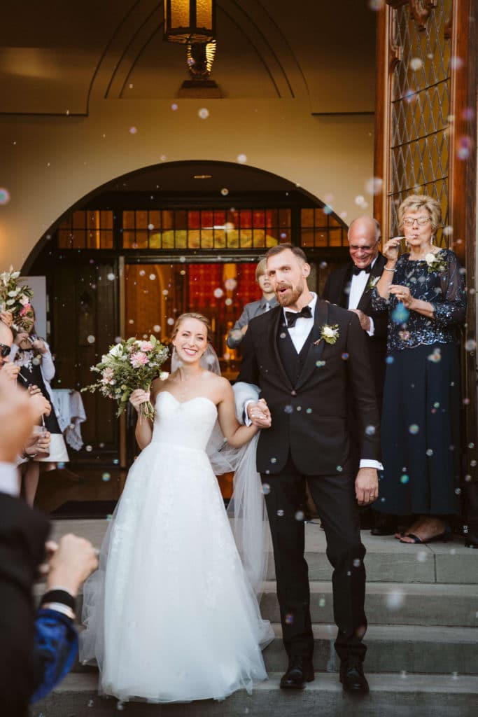 Bubble send off at the Basilica of Saints Peter and Paul. Photo by OkCrowe Photography.