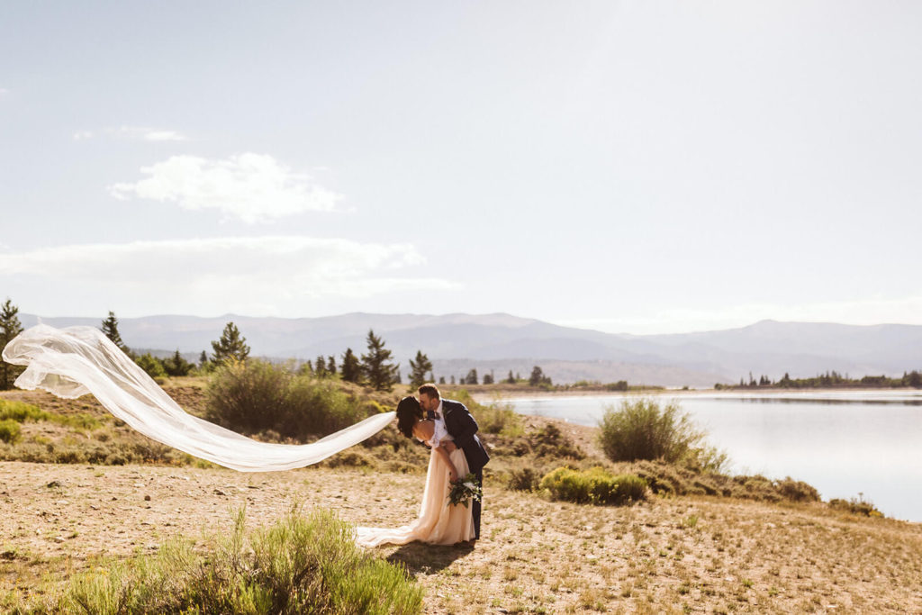 Bride and groom sunrise Twin Lakes in Buena Vista, Colorado. Photo by OkCrowe Photography.