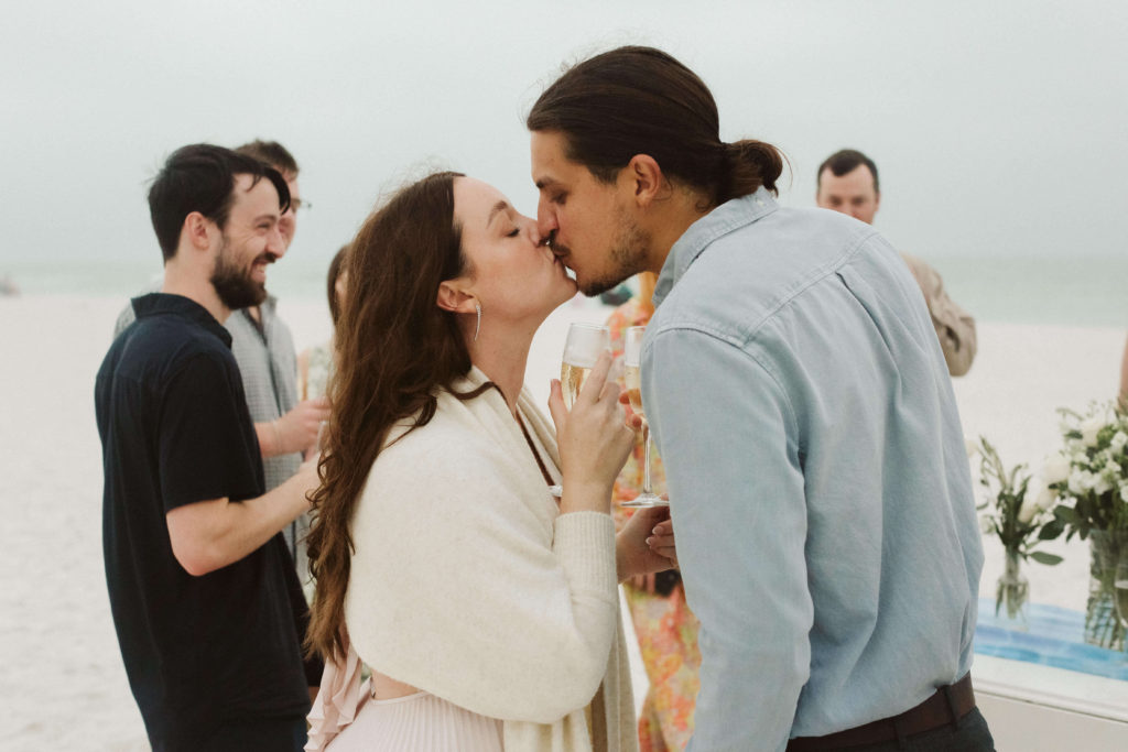 Rehearsal dinner photography coverage on a beach in Sarasota, FL. Photo by OkCrowe Photography.