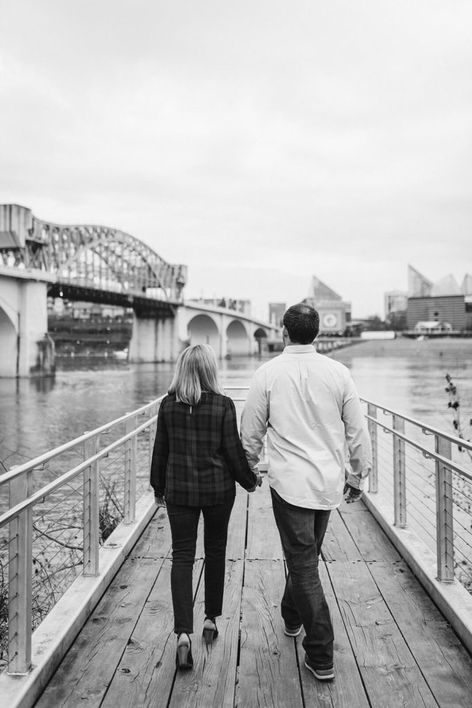 Engagement session in Coolidge Park overlooking the river. Photo by OkCrowe Photography.