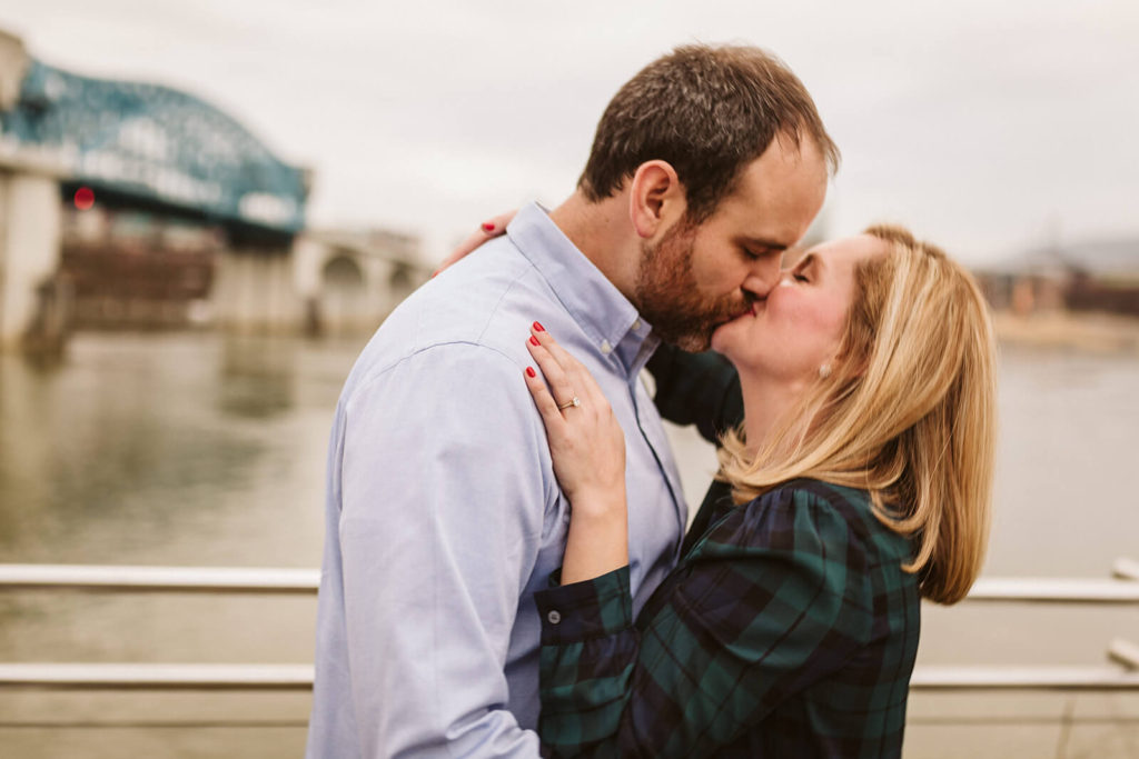 Engagement session in Coolidge Park overlooking the river. Photo by OkCrowe Photography.