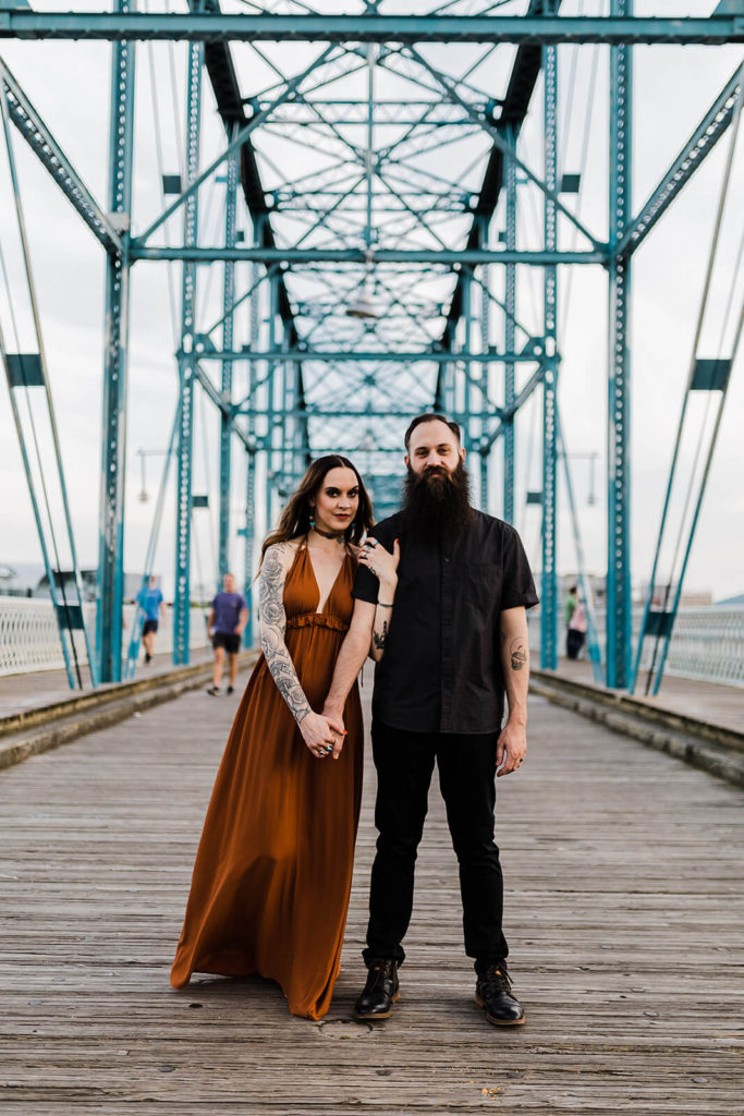 Engagement session on the Walnut St Bridge overlooking the river. Photo by OkCrowe Photography.