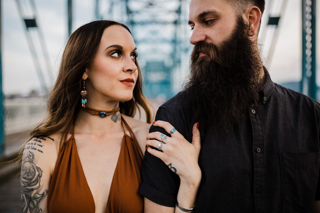 Engagement session on the Walnut St Bridge overlooking the river. Photo by OkCrowe Photography.