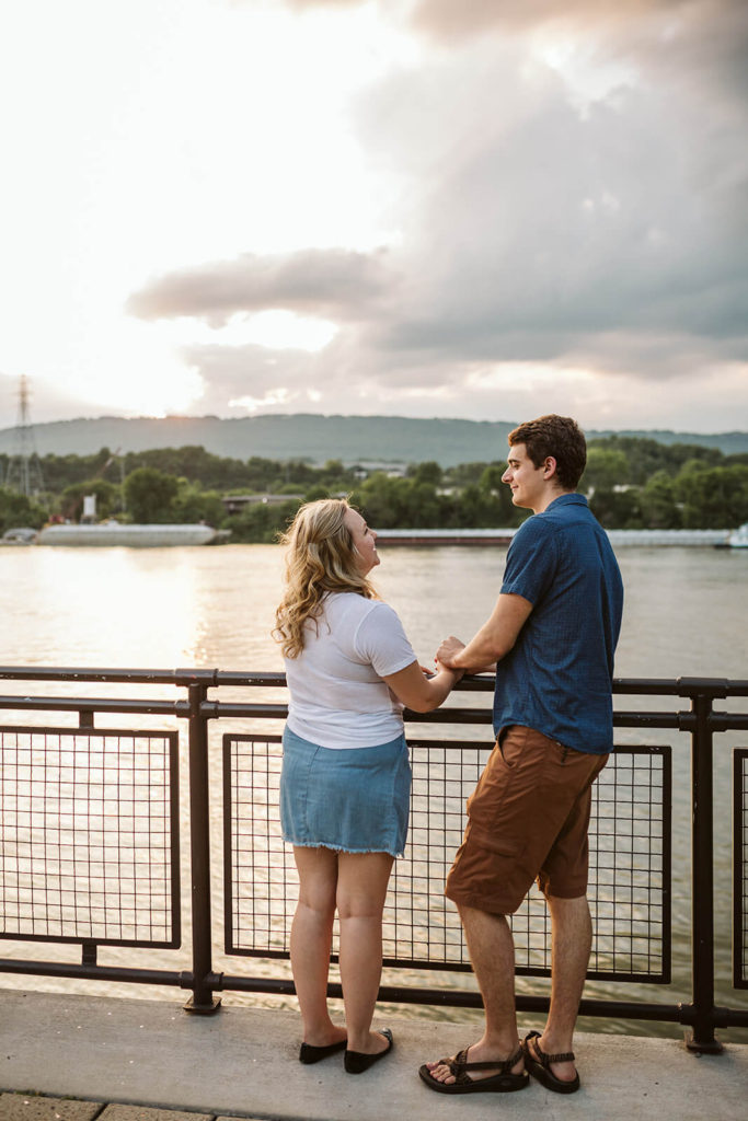 Engagement session in the Riverwalk in Chattanooga by the river. Photo by OkCrowe Photography.