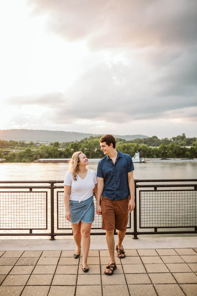 Engagement session in the Riverwalk in Chattanooga by the river. Photo by OkCrowe Photography.