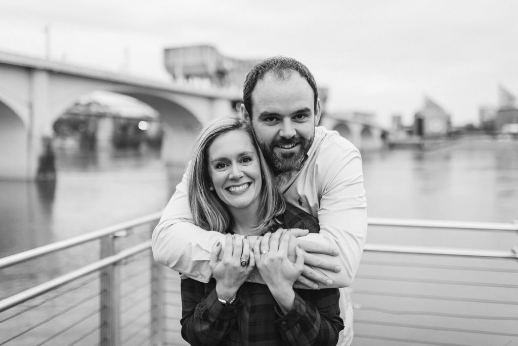 Engagement session in Coolidge Park overlooking the river. Photo by OkCrowe Photography.