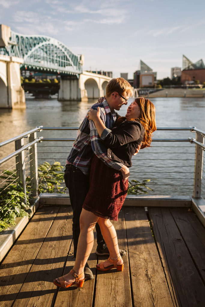 Engagement session in Coolidge Park overlooking the river. Photo by OkCrowe Photography.