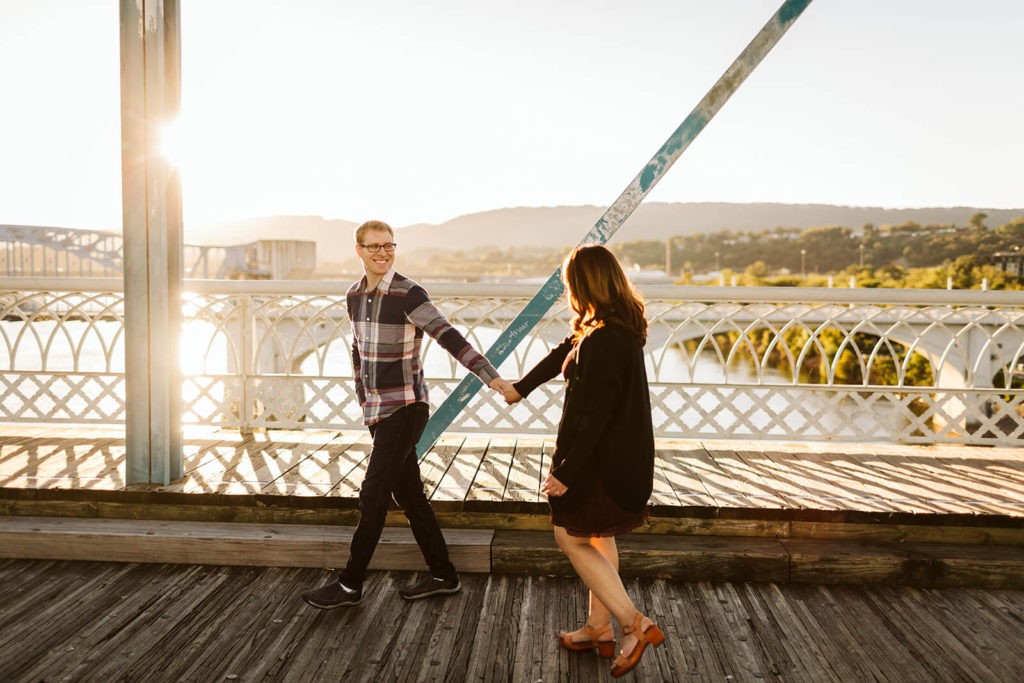 Engagement session in Coolidge Park overlooking the river. Photo by OkCrowe Photography.