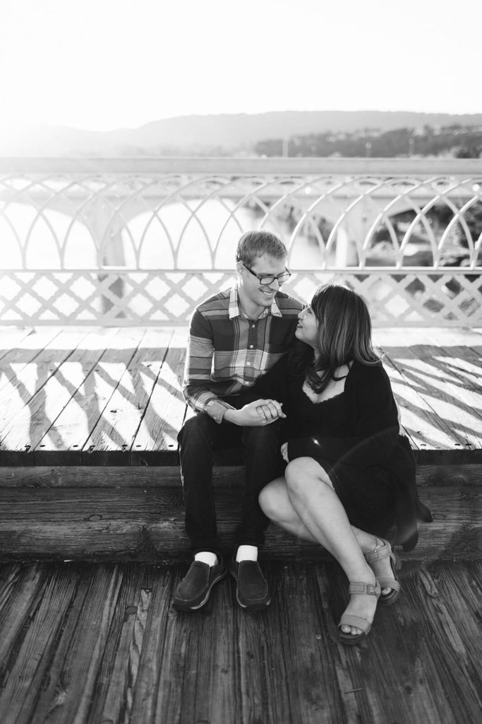 Engagement session in Coolidge Park overlooking the river. Photo by OkCrowe Photography.