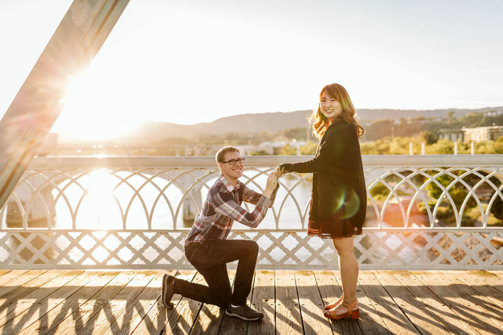 Engagement session in Coolidge Park overlooking the river. Photo by OkCrowe Photography.