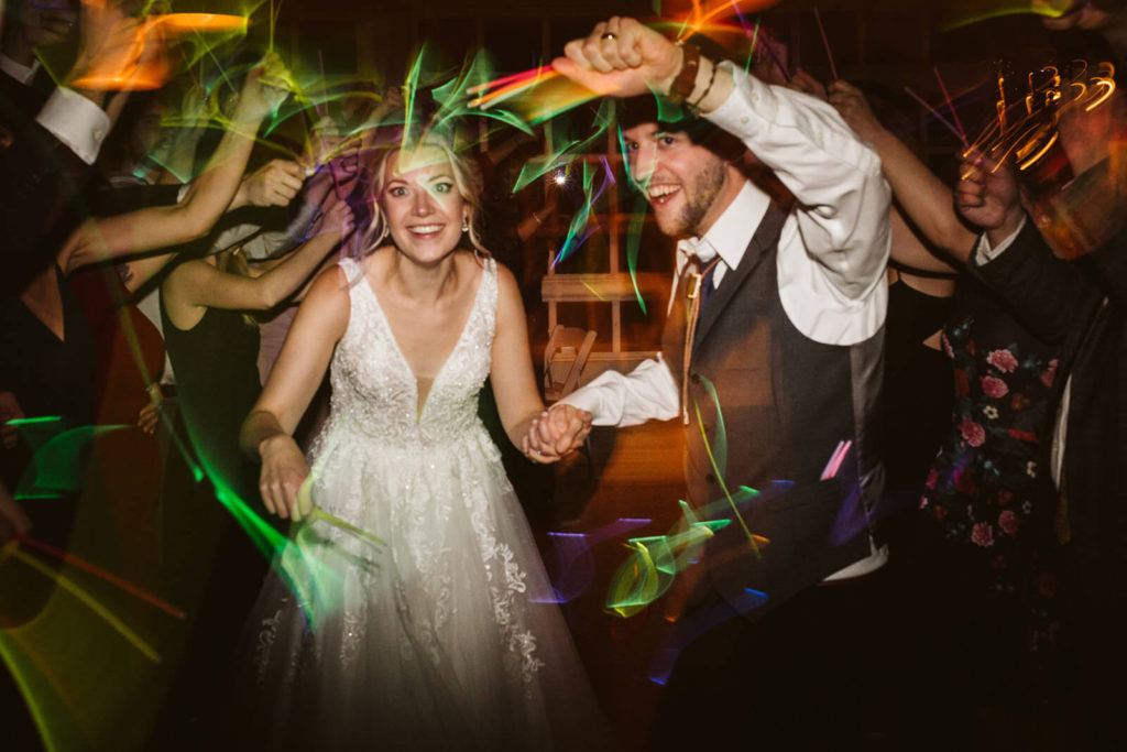 Examples of glow sticks wedding send offs. Photo by OkCrowe Photography.