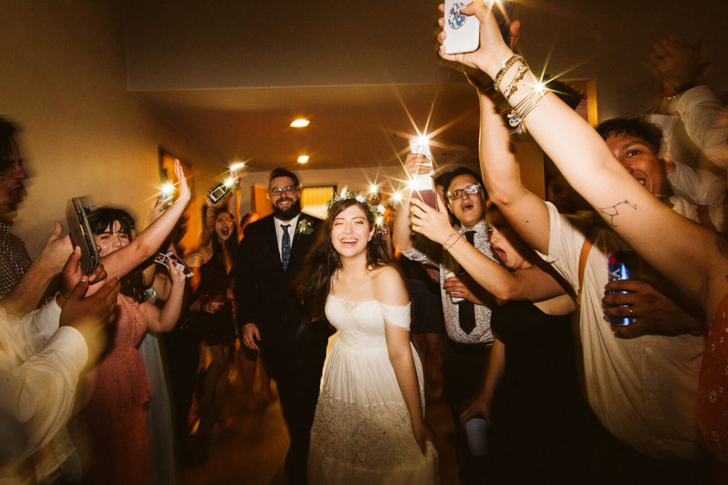 Examples of phone light wedding send offs. Photo by OkCrowe Photography.