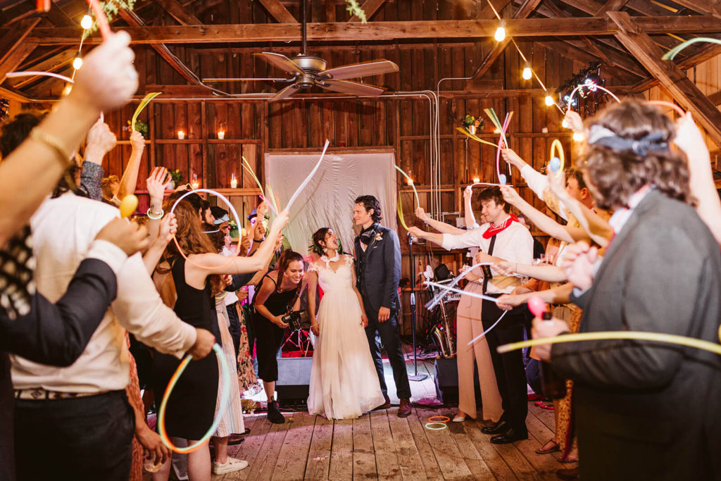 Examples of glow sticks wedding send offs. Photo by OkCrowe Photography.