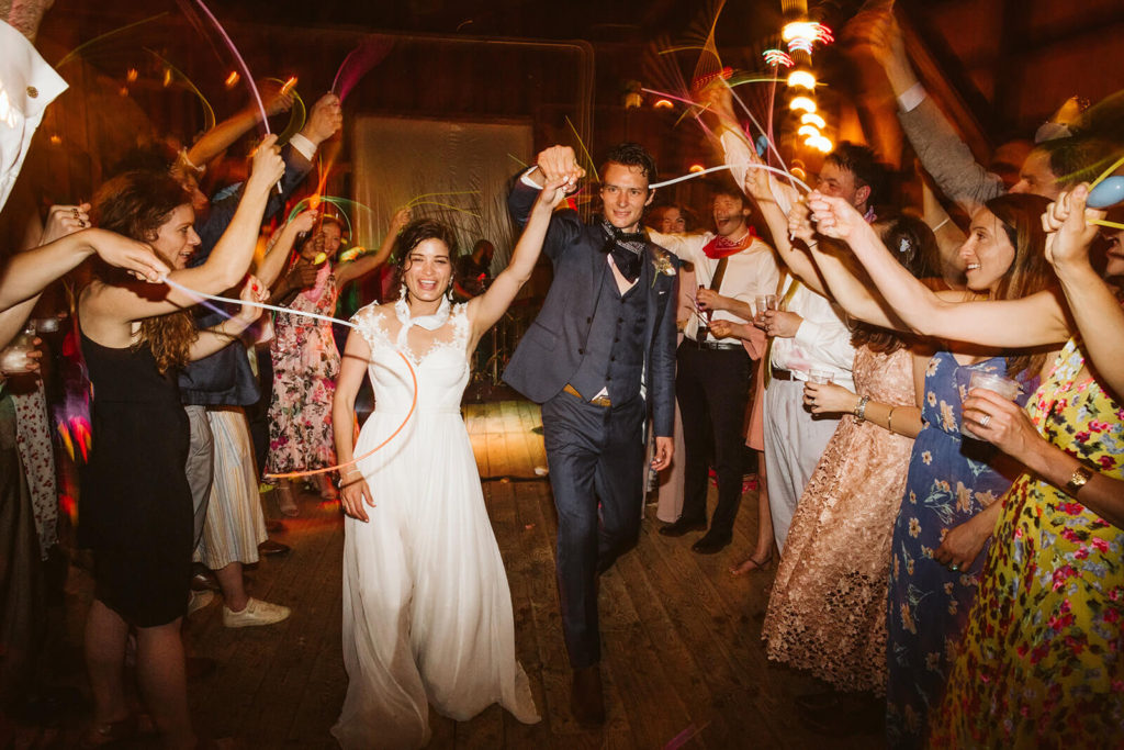 Examples of glow sticks wedding send offs. Photo by OkCrowe Photography.