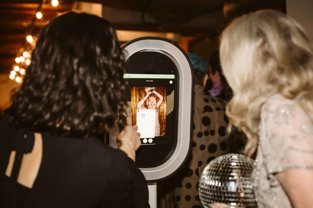 The OkCrowe Photo Booth in action during weddings and events. Photo by OkCrowe.