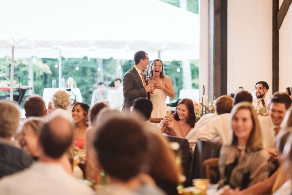 Wedding reception and dancing in the rain at the Hidden Springs Venue. Photo by OkCrowe Photography.