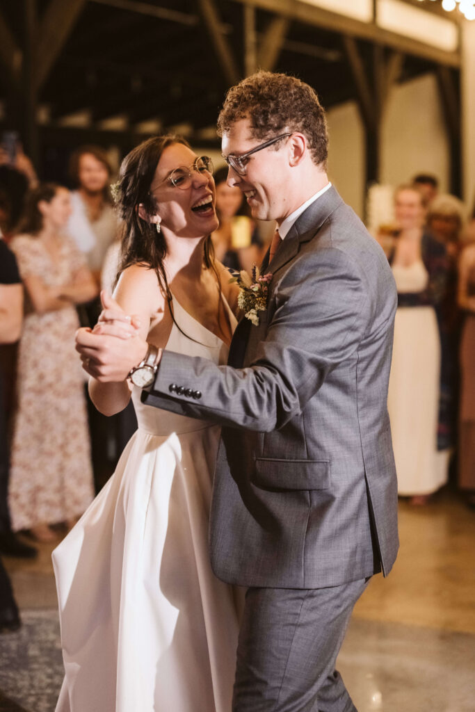 Wedding reception and dancing in the rain at the Hidden Springs Venue. Photo by OkCrowe Photography.