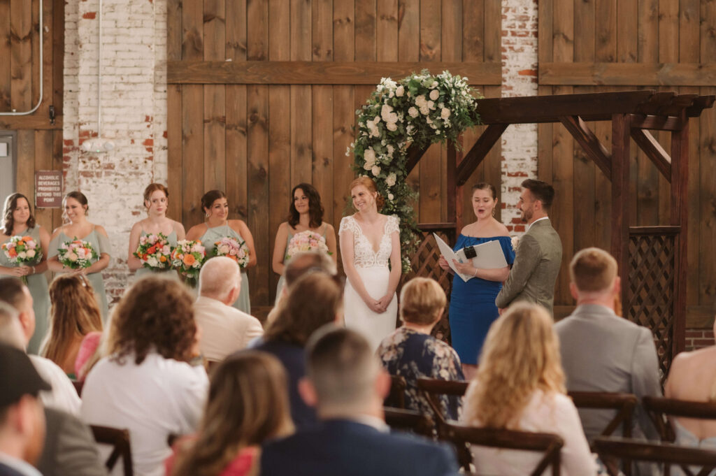 Wedding ceremony at Brick South in Portland, Maine. Photo by OkCrowe Photography.