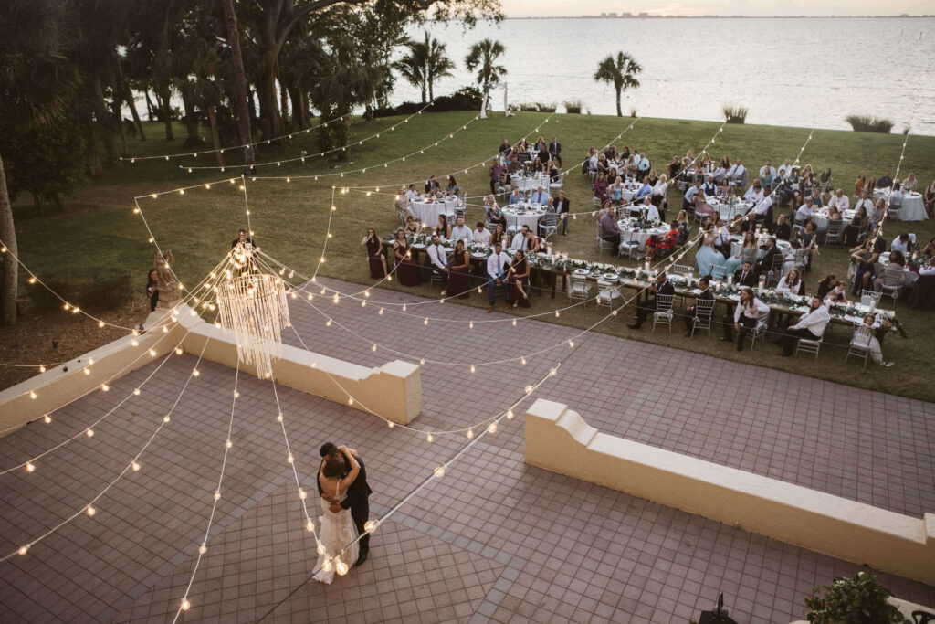 Wedding reception on the patio at the Powel Crosley Estate in Sarasota, Florida. Photo by OkCrowe Photography.