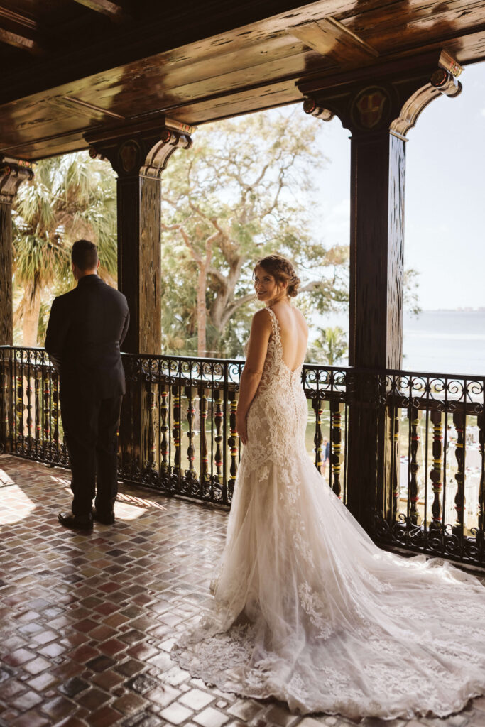 Bride and groom first look at the Powel Crosley Estate in Sarasota, Florida. Photo by OkCrowe Photography. 