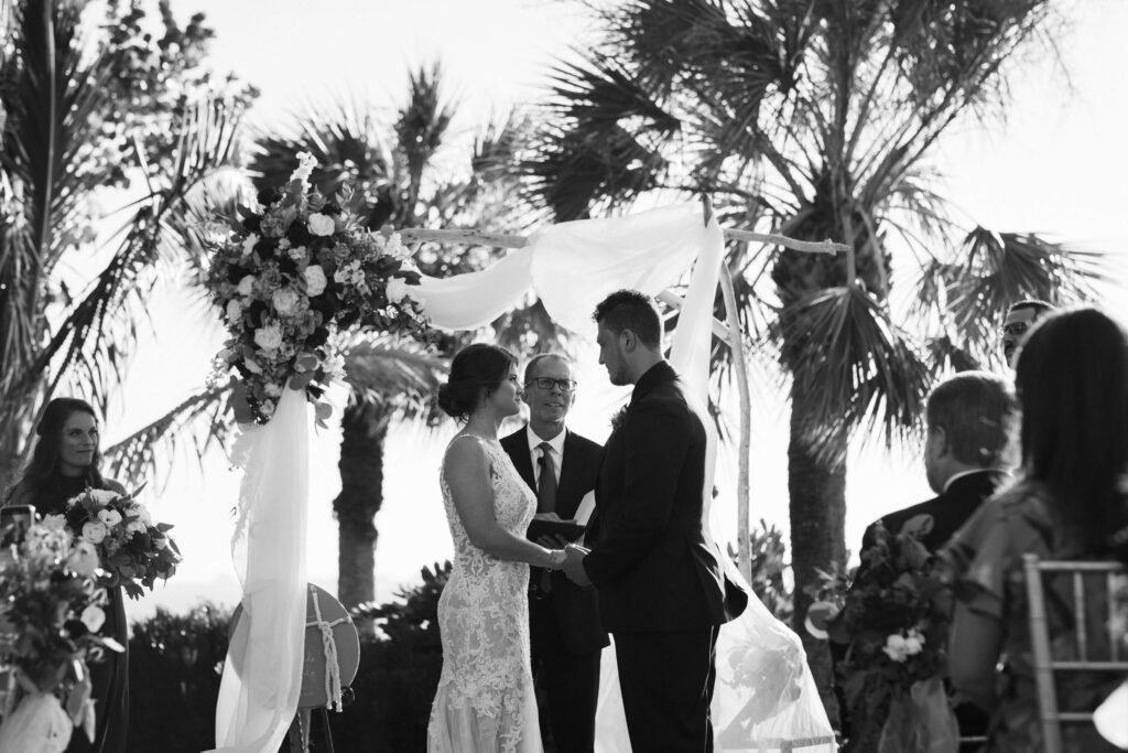 Beach themed wedding ceremony on the lawn at the Powel Crosley Estate in Sarasota, Florida. Photo by OkCrowe Photography.