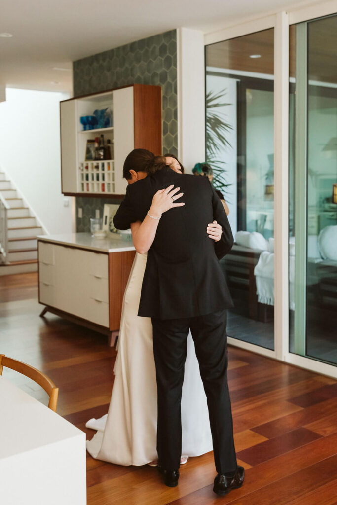 Couple's first look in a private family home in Sarasota, Florida. Photo by OkCrowe Photography. 