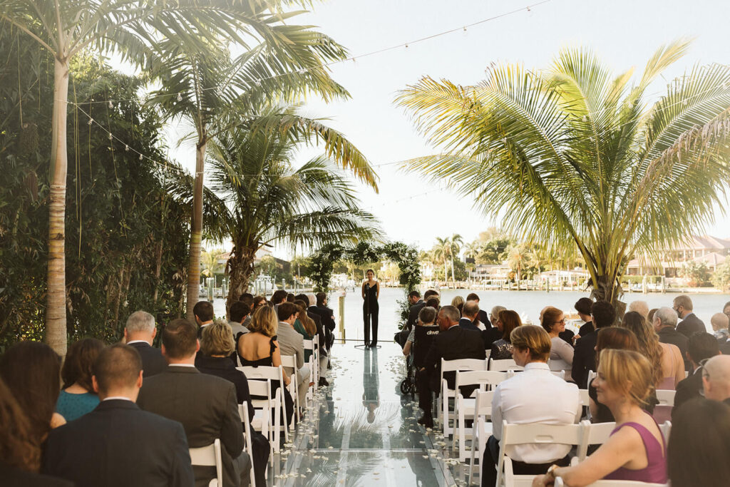 Backyard wedding ceremony in a private family home in Sarasota, Florida. Photo by OkCrowe Photography.