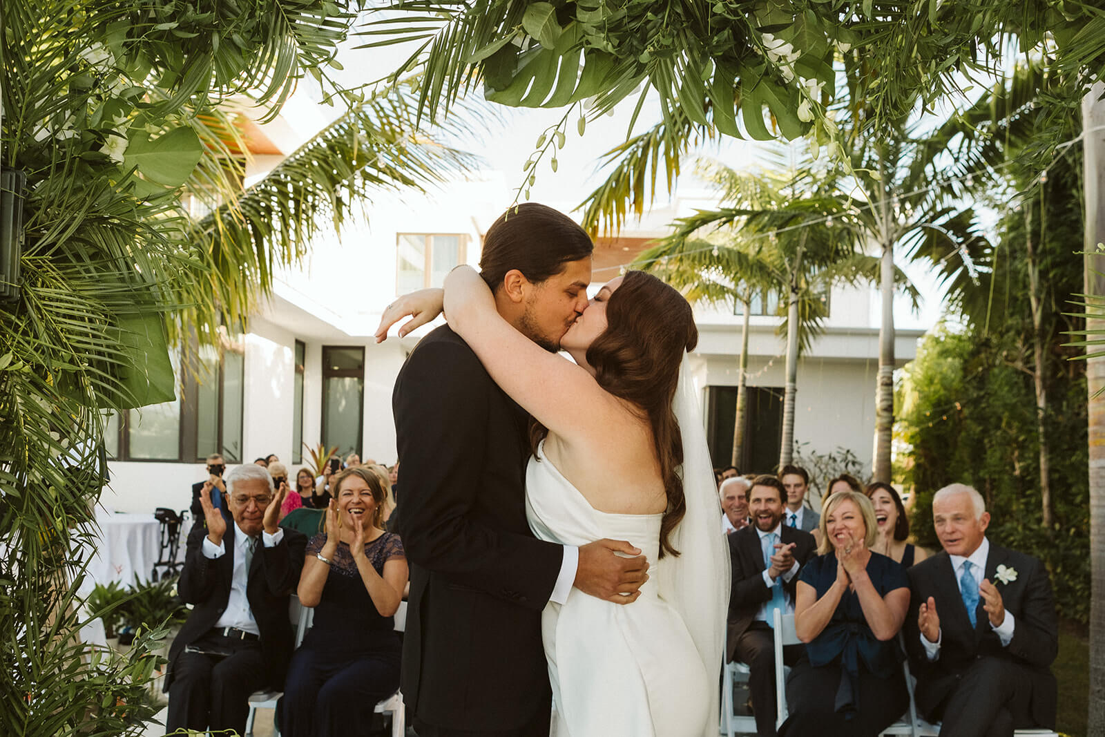 Backyard wedding ceremony in a private family home in Sarasota, Florida. Photo by OkCrowe Photography.