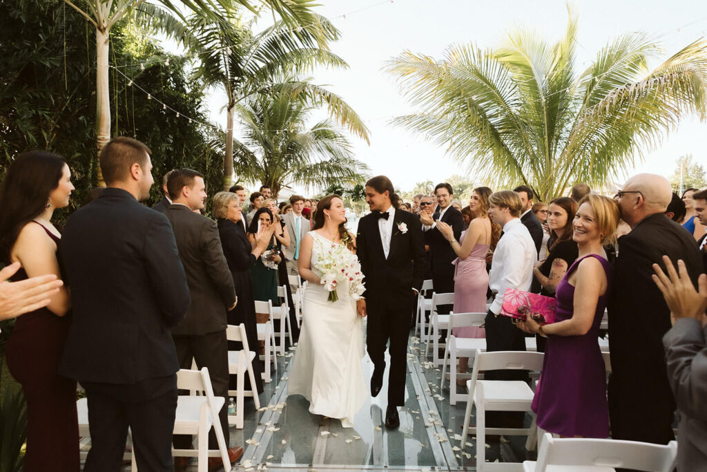 Backyard wedding ceremony in a private family home in Sarasota, Florida. Photo by OkCrowe Photography.